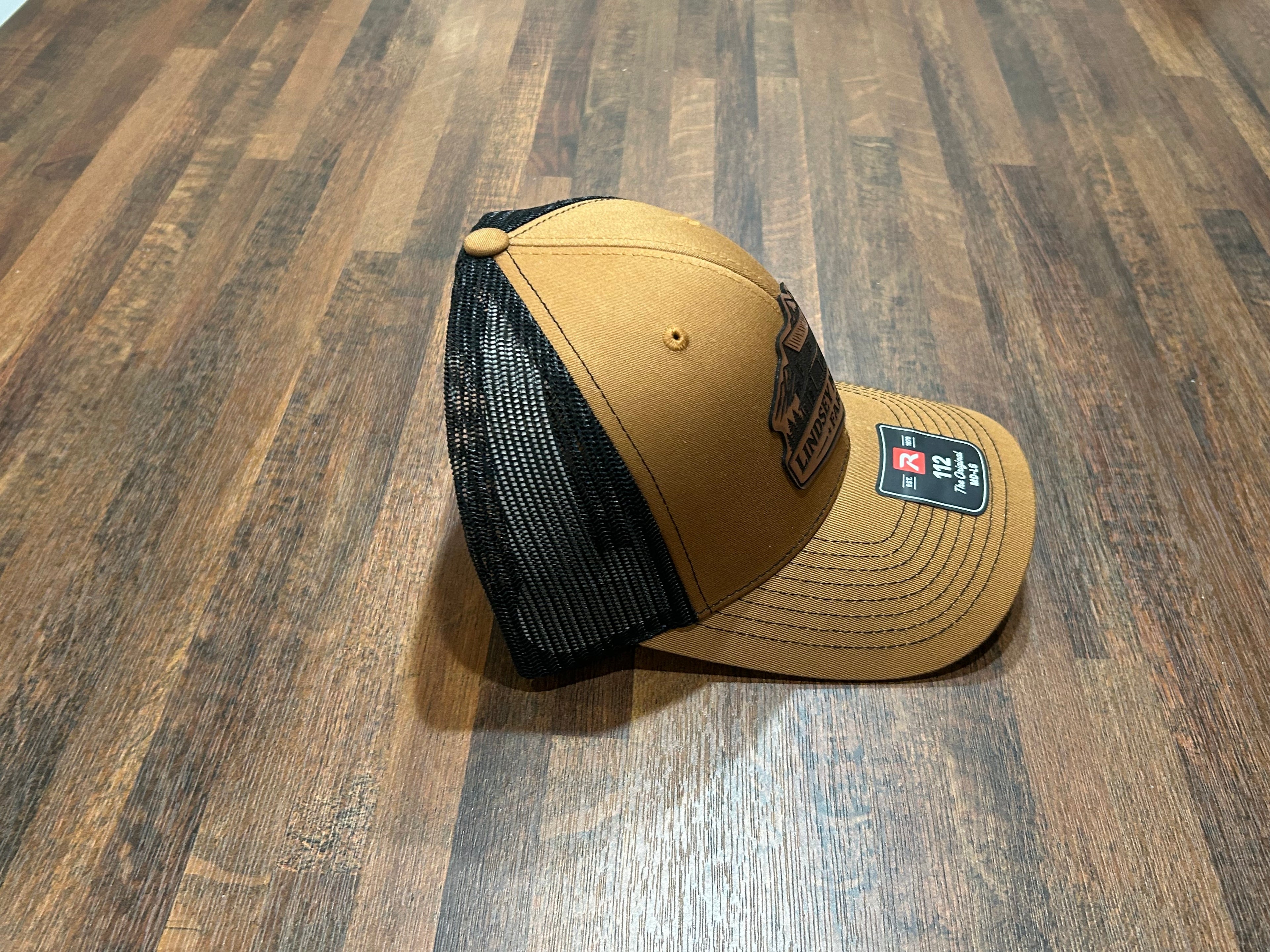 Lindsey Mountain Farms Leather Patch Trucker Hat – Carmel/Black Richardson 112